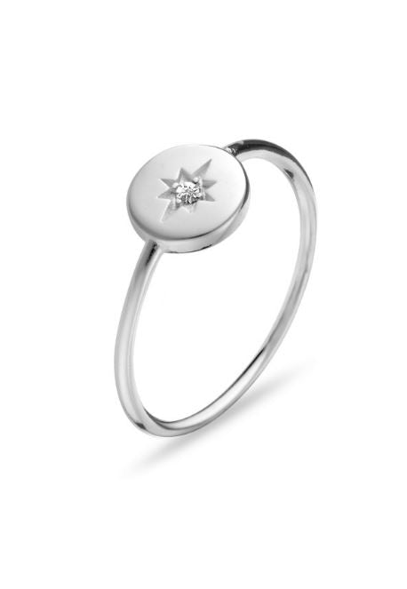 Sterling silver disc ring with star featuring white cubic zirconia